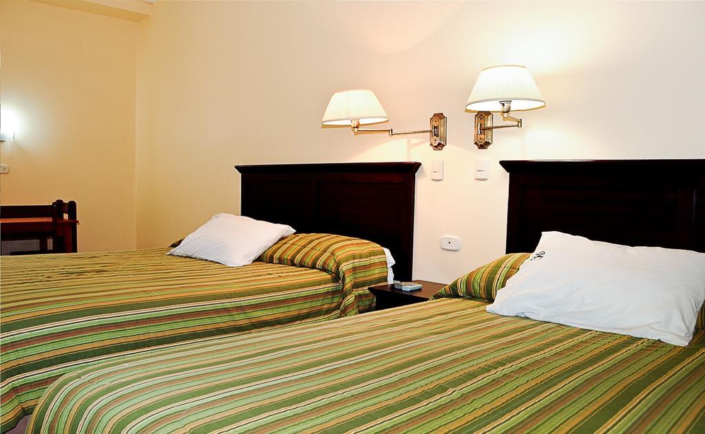 Hotel Presidente Selva La Merced  Rum bild